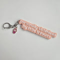 "personally victimized by little trinkets" Keychain